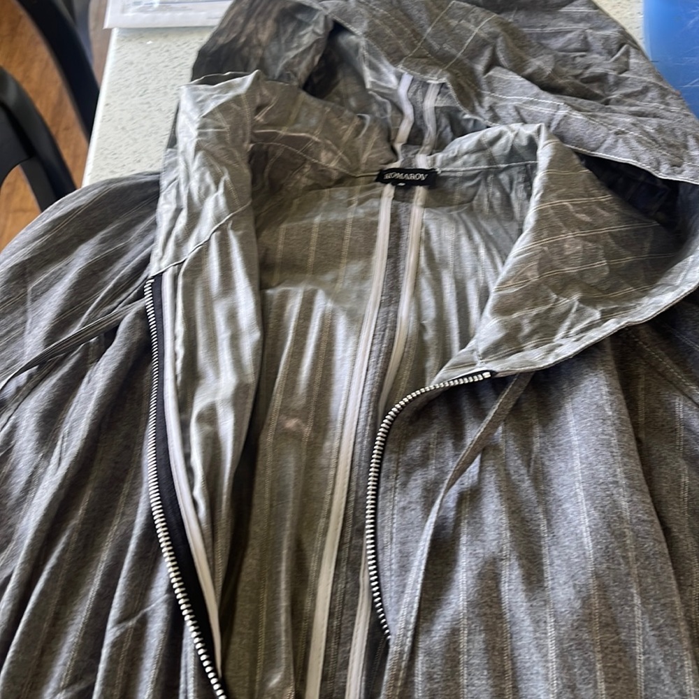 3/4 length light jacket with hood. New without tags. Light weight.